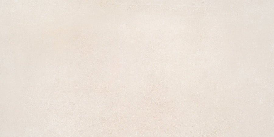 Ardennes 12" x 24" Tile in Blonde features a light beige, stone-like textured surface with subtle color variations and faint speckles—perfect for accent walls or statement floors.
