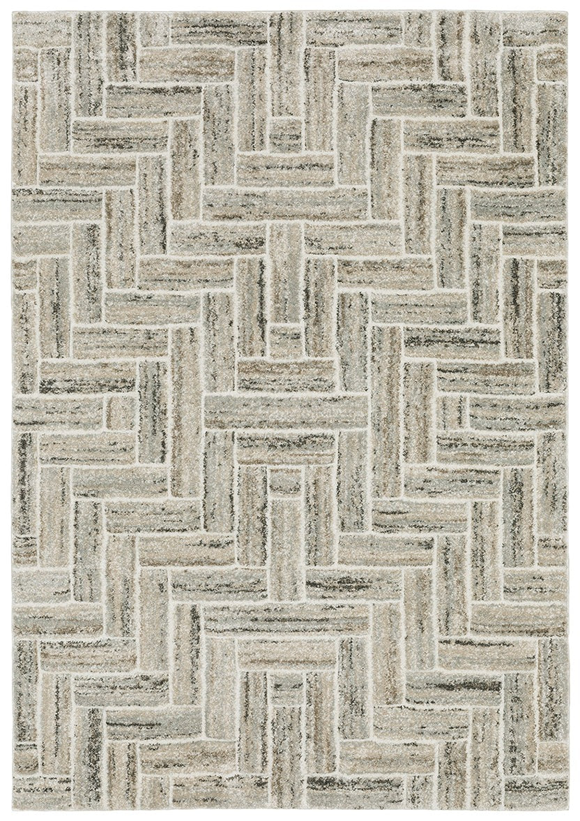 The Cambria Area Rug boasts a rectangular shape and basketweave pattern in neutral beige, gray, and cream tones. Crafted from soft polypropylene, it offers a geometric look and subtle elegance for any space.