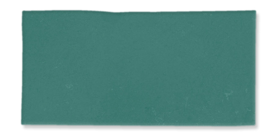 A rectangular piece of textured teal paper with slightly uneven edges, set against a white background.