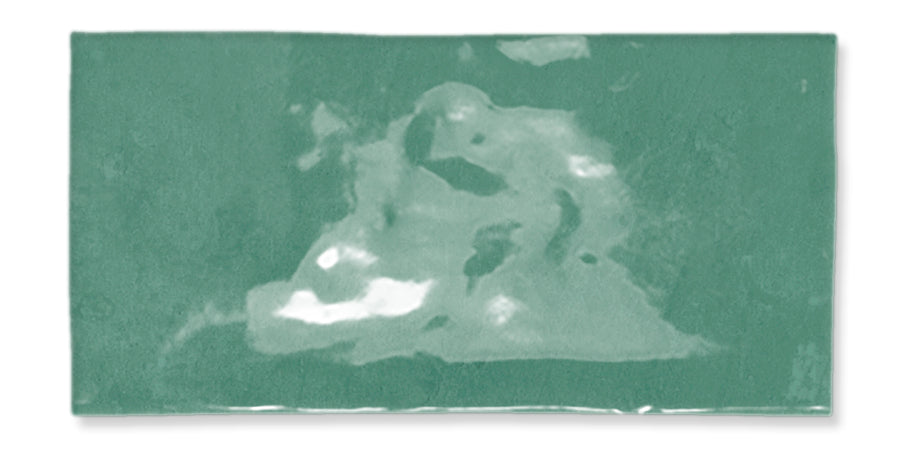 A rectangular green tile with a glossy surface featuring irregular lighter and darker patches that create a marbled effect.