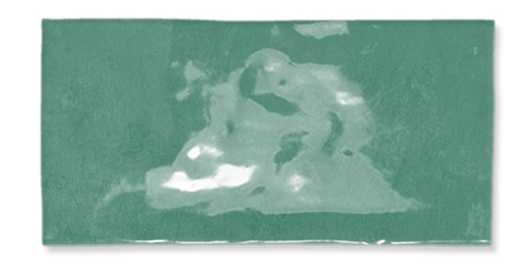 A rectangular green tile with a glossy surface featuring irregular lighter and darker patches that create a marbled effect.