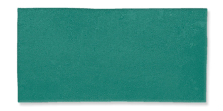 A rectangular, flat teal tile with a slightly textured surface and subtle color variations. The background is white.