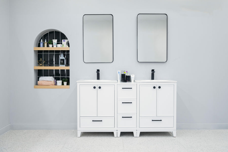 A modern bathroom features the Frame 60" Vanity, black faucets, rectangular mirrors, and a recessed shelf on the left for toiletries and towels. Light-colored walls and floors complete the clean, minimalist look.