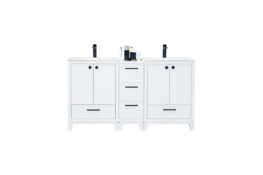 A modern white double-sink bathroom vanity with black handles, two sets of cabinets and drawers, and two black faucets, with toiletries placed between the sinks.