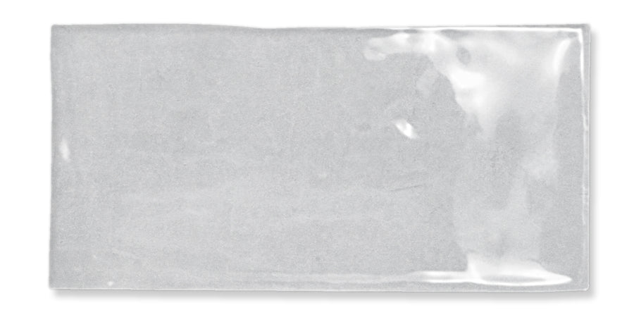 A clear rectangular plastic bag with a glossy surface, lying flat and empty on a white background.