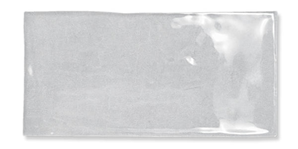 A clear rectangular plastic bag with a glossy surface, lying flat and empty on a white background.