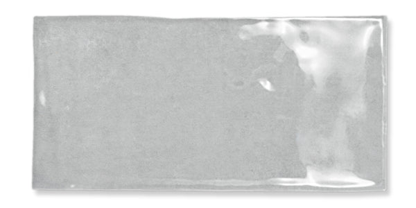 A rectangular, clear plastic sleeve or pouch with a glossy surface, laying flat against a white background. The sleeve appears empty and has slight reflections and creases.
