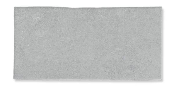 A rectangular, light gray concrete slab with a slightly uneven top edge and a smooth surface.