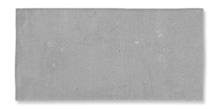 A rectangular, flat, gray concrete slab with a smooth surface and slight texture, set against a white background.