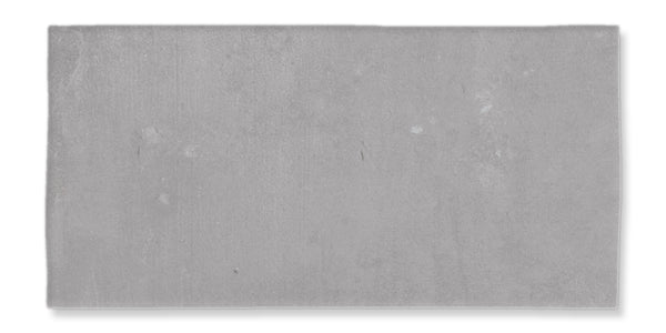 A rectangular, flat, gray concrete slab with a smooth surface and slight texture, set against a white background.