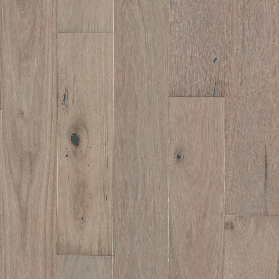 Main Street 7 1/2" White Oak Hardwood features light brown planks with natural grain, knots, and subtle color variations for a rustic, textured look.