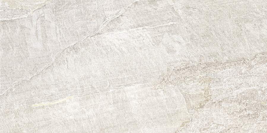 Montagna 24x48 Porcelain Tile features a light gray surface with subtle natural veining and slate visuals. This durable tile offers a soft, weathered look, gentle color variations, and a stylish matte finish.