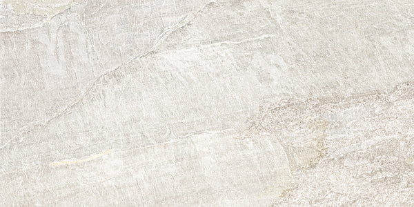 Montagna 24x48 Porcelain Tile features a light gray surface with subtle natural veining and slate visuals. This durable tile offers a soft, weathered look, gentle color variations, and a stylish matte finish.