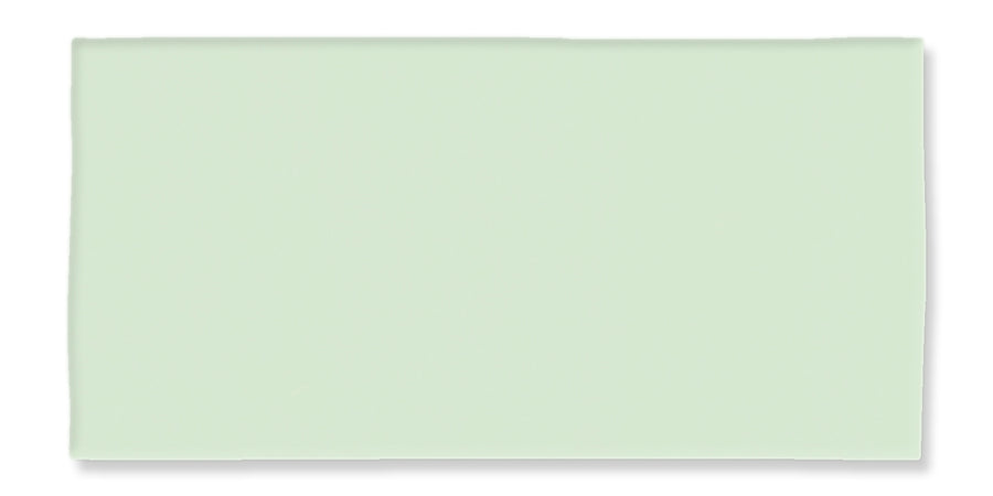 A rectangular, light green foam sheet with smooth edges and a flat surface, photographed against a white background.