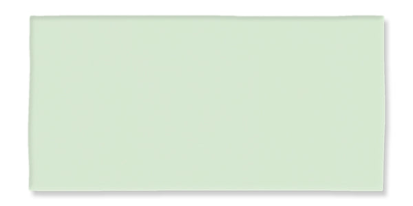 A rectangular, light green foam sheet with smooth edges and a flat surface, photographed against a white background.