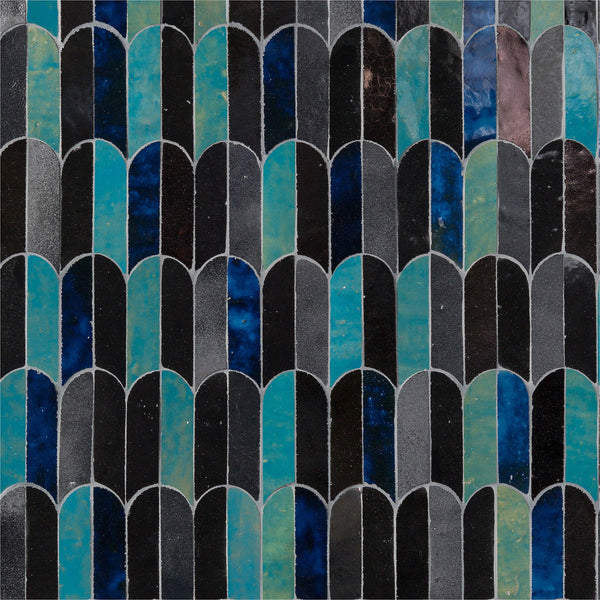 The Mistral Bab Mosaic features distinctive curved, arch-shaped tiles in black, blue, teal, and dark green, showcasing artistic elegance through its unique repeating and overlapping design.