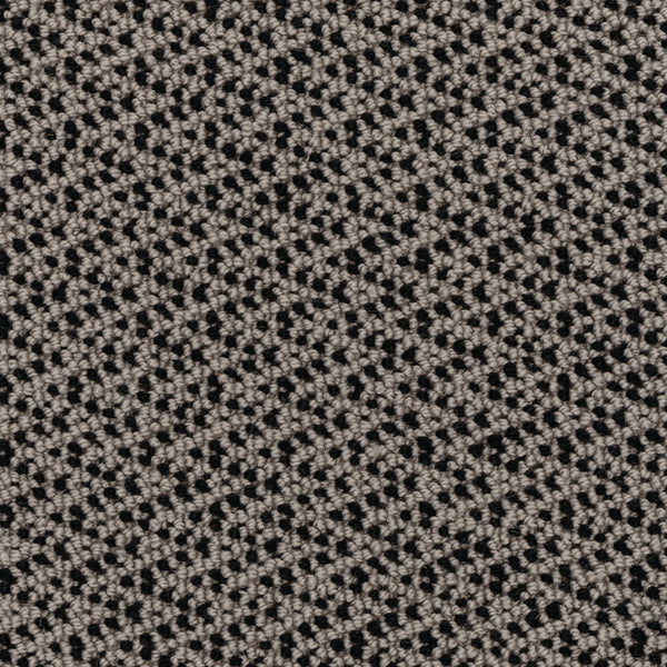 Close-up of the Fretwork On Trend Carpet in Modeled Stone, featuring a textured fabric with a repeating small, diamond-like geometric pattern in beige and black, creating a woven look that suggests durable construction.