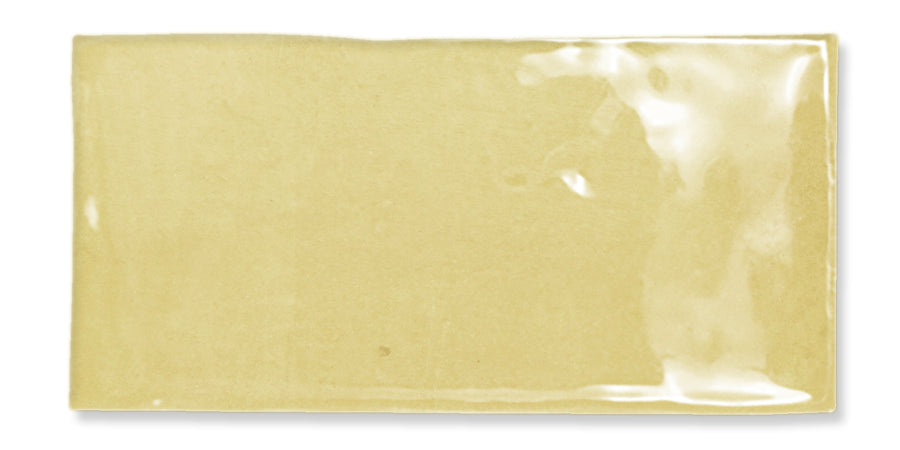 A single rectangular sheet of uncooked, light yellow lasagna pasta with a smooth, glossy surface, photographed on a white background.