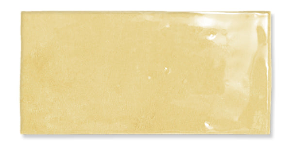 Rectangular, glossy yellow ceramic tile with a slightly uneven surface and subtle color variations.