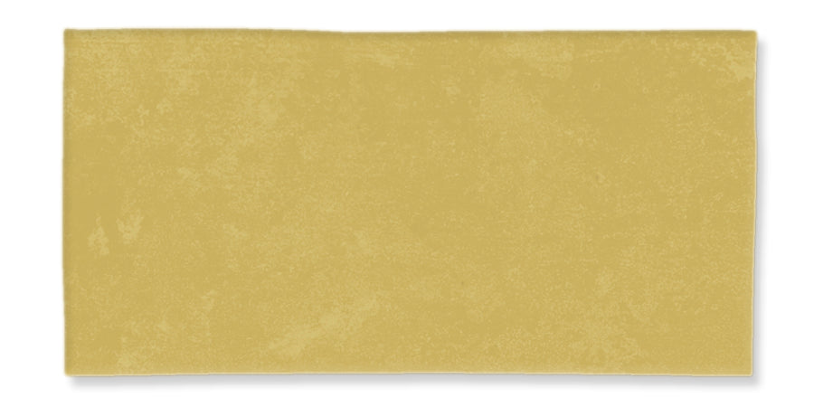 A plain, rectangular sheet of uncooked pasta dough with a light yellow color and a slightly textured surface, set against a white background.