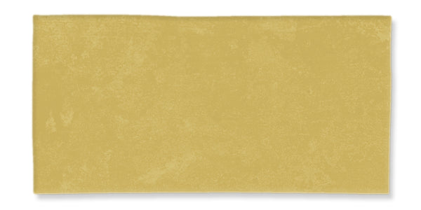A plain, rectangular sheet of uncooked pasta dough with a light yellow color and a slightly textured surface, set against a white background.