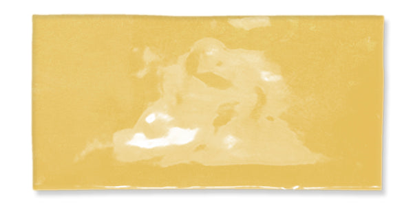 A rectangular slice of yellow American cheese with a shiny, smooth surface and slightly uneven coloration, set against a white background.