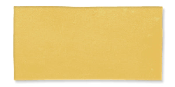 A single, rectangular slice of yellow cheese shown against a white background.