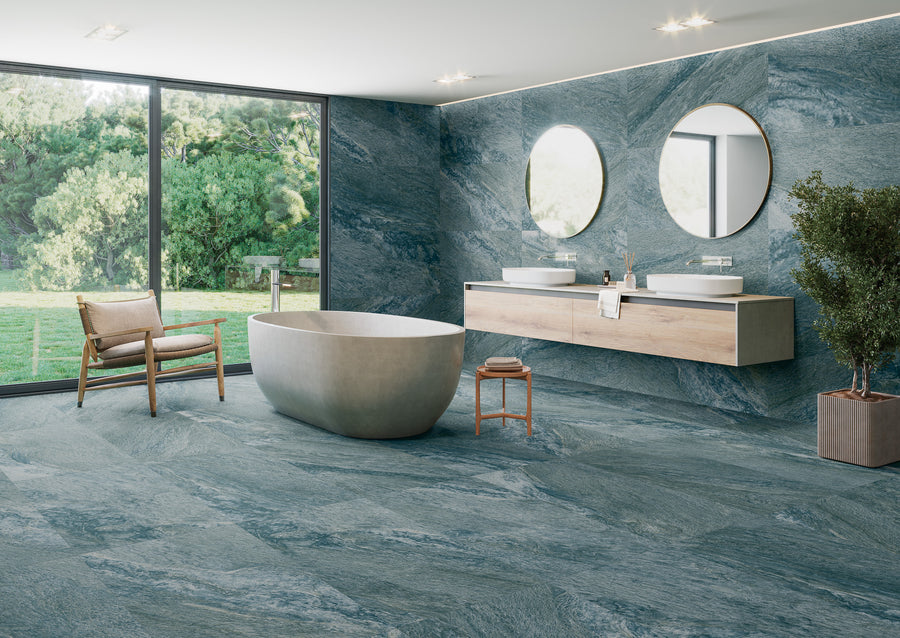 A bathroom with a tub and mirrors.