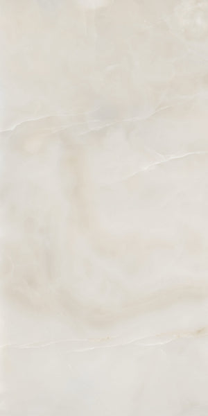 A smooth, light beige marble surface with subtle, wavy veins and soft, cloudy patterns throughout.