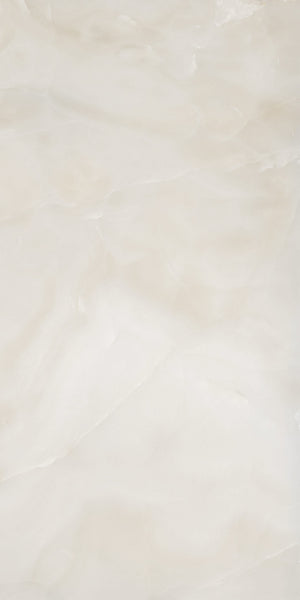 A smooth, off-white marble surface with subtle, wavy light beige and cream veins and cloudy patterns throughout, giving it a soft, natural, and polished appearance.
