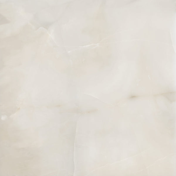 A close-up of a smooth, polished marble surface featuring soft, creamy beige and white tones with subtle natural veins and patterns throughout.