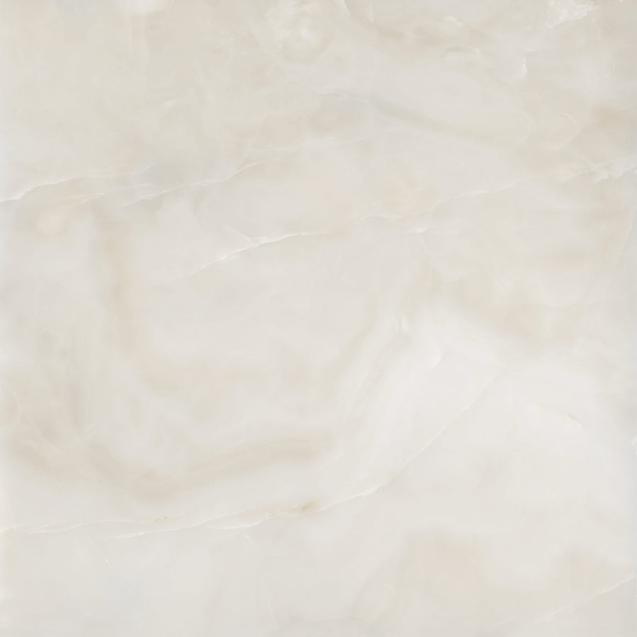 White marble surface with subtle beige and light gray veining, creating a smooth, polished texture and a natural, elegant appearance.