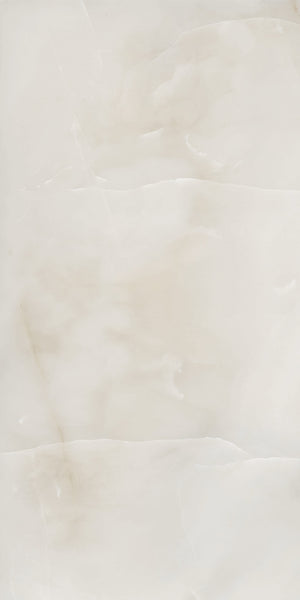 A smooth, light beige marble surface with subtle veins and cloudy patterns, giving a soft, elegant appearance.