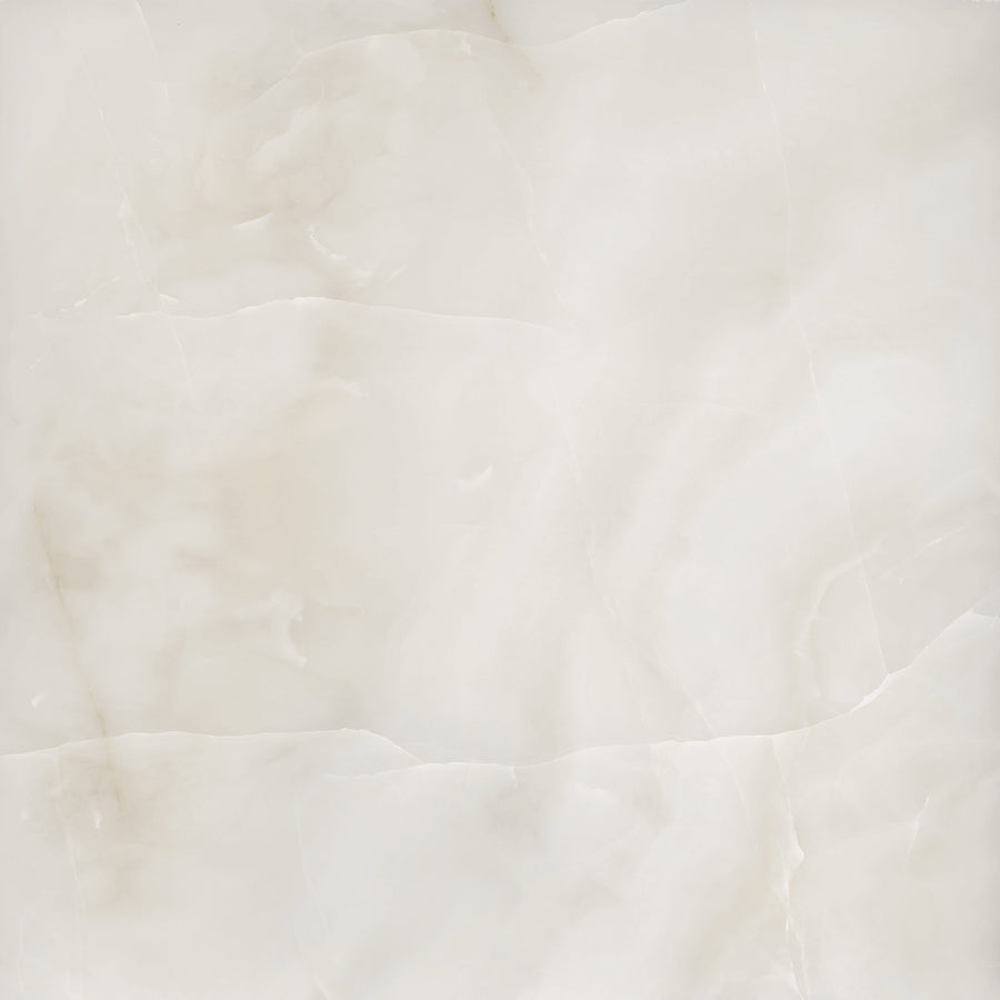 A smooth, beige marble surface with subtle, natural veining and soft, cloudy patterns in varying shades of cream and light brown.