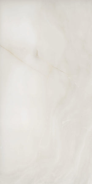 A smooth, light beige marble surface with subtle veins and cloudy patterns running diagonally. The texture has a natural, polished look, with soft variations in color and faint cracks visible.