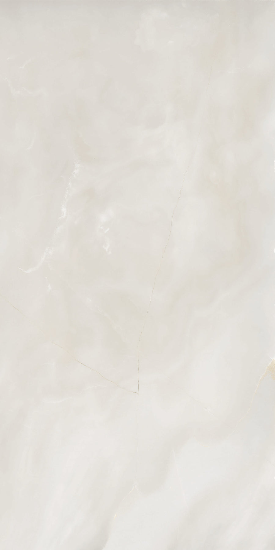 A smooth, light beige marble surface with subtle white and cream swirls and faint, thin cracks running diagonally across the stone.