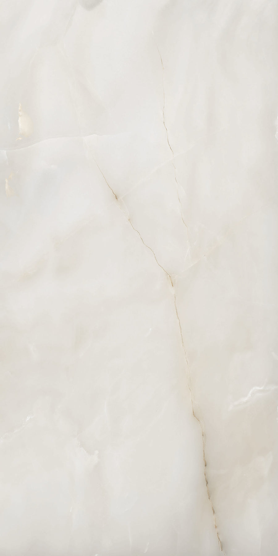 White marble surface with subtle beige veining and natural, irregular cracks running diagonally across the stone, giving it a smooth and polished appearance.