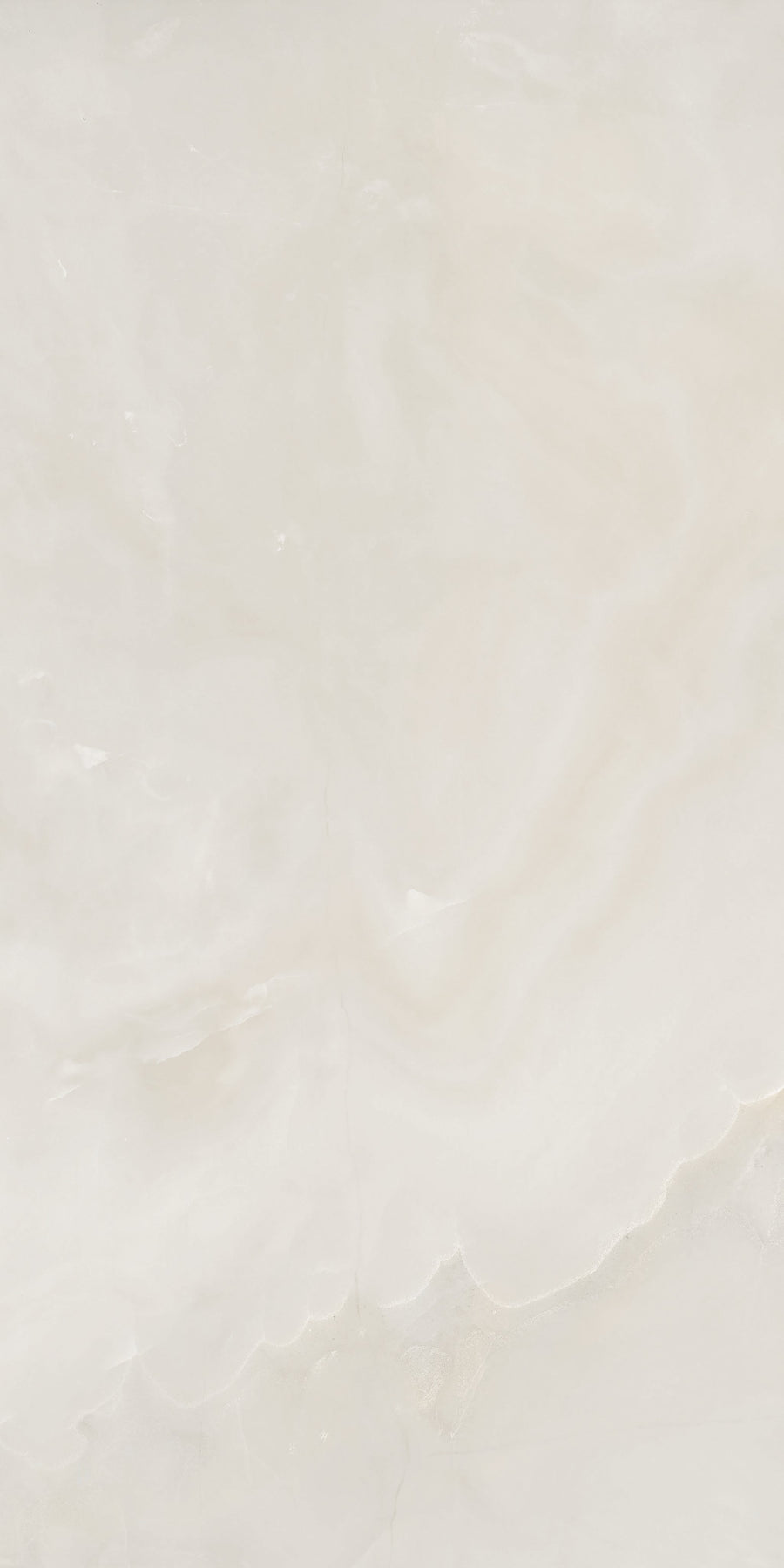 Light beige marble surface with subtle, wavy patterns and soft, cloudy textures. The overall appearance is smooth and polished, with gentle gradients of cream and off-white tones.
