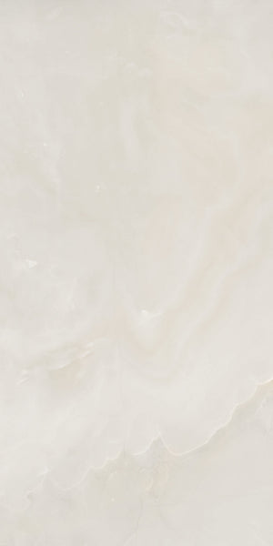 Light beige marble surface with subtle, wavy patterns and soft, cloudy textures. The overall appearance is smooth and polished, with gentle gradients of cream and off-white tones.