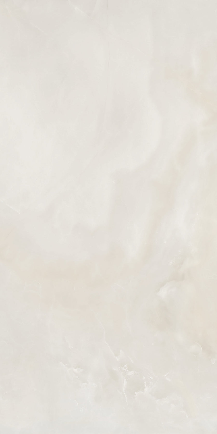 A smooth, light beige marble surface with subtle veining and soft, cloudy patterns throughout. The texture appears polished and glossy, giving a clean and elegant appearance.