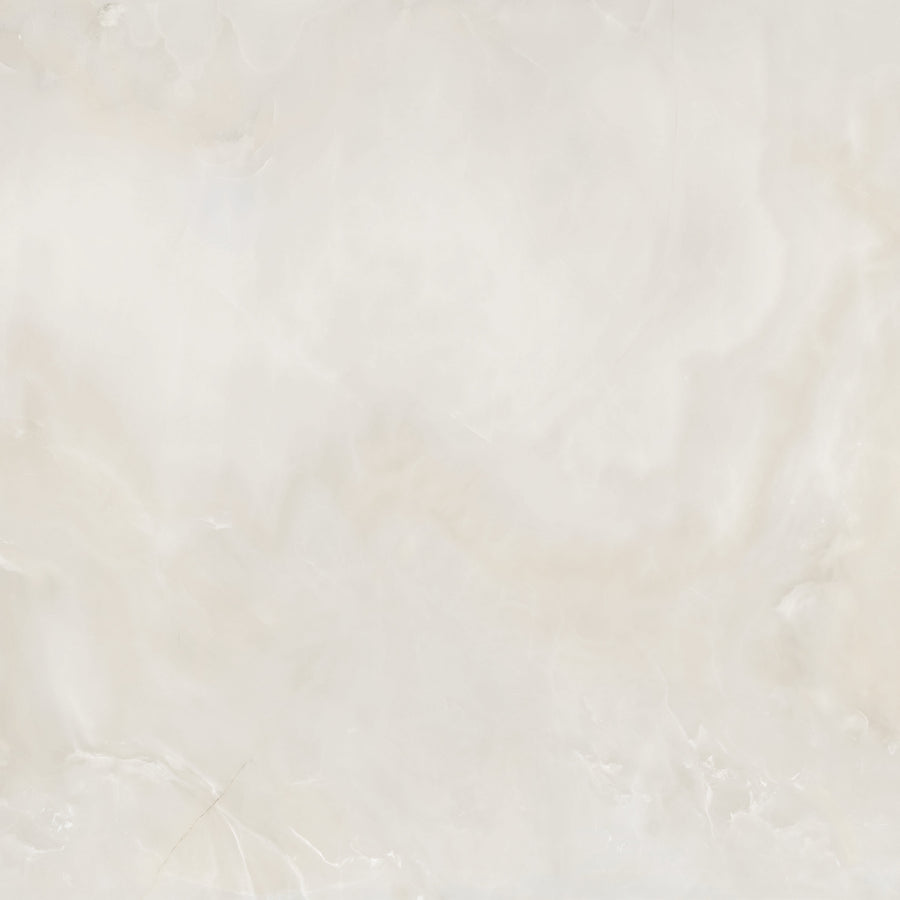 A smooth, light beige marble surface with subtle white and cream veining patterns, giving a soft, elegant, and slightly cloudy appearance.