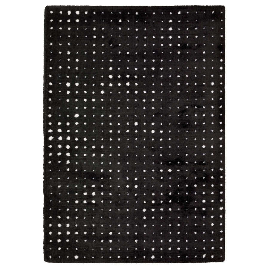 The Galileo 04 Area Rug is a rectangular black rug with a chic grid of small white dots, adding a sophisticated and cozy touch to any room.