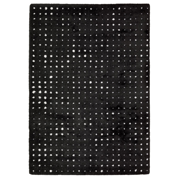 The Galileo 04 Area Rug is a rectangular black rug with a chic grid of small white dots, adding a sophisticated and cozy touch to any room.