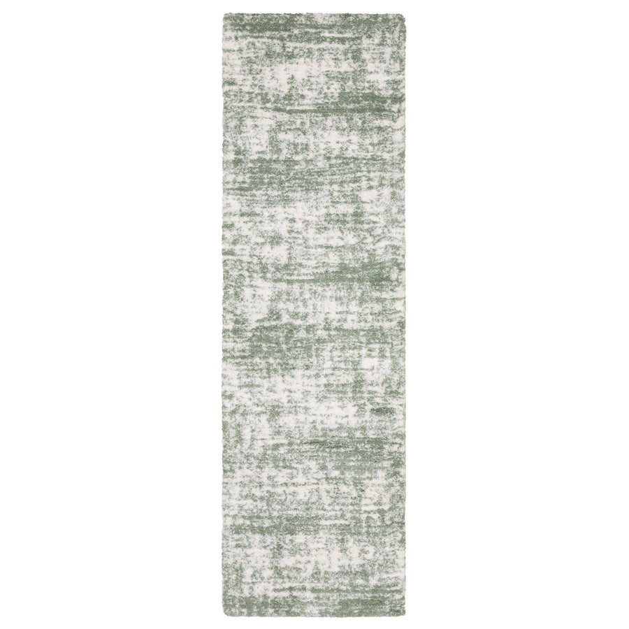 A rectangular runner rug with a distressed green and white pattern, featuring a textured, mottled design.