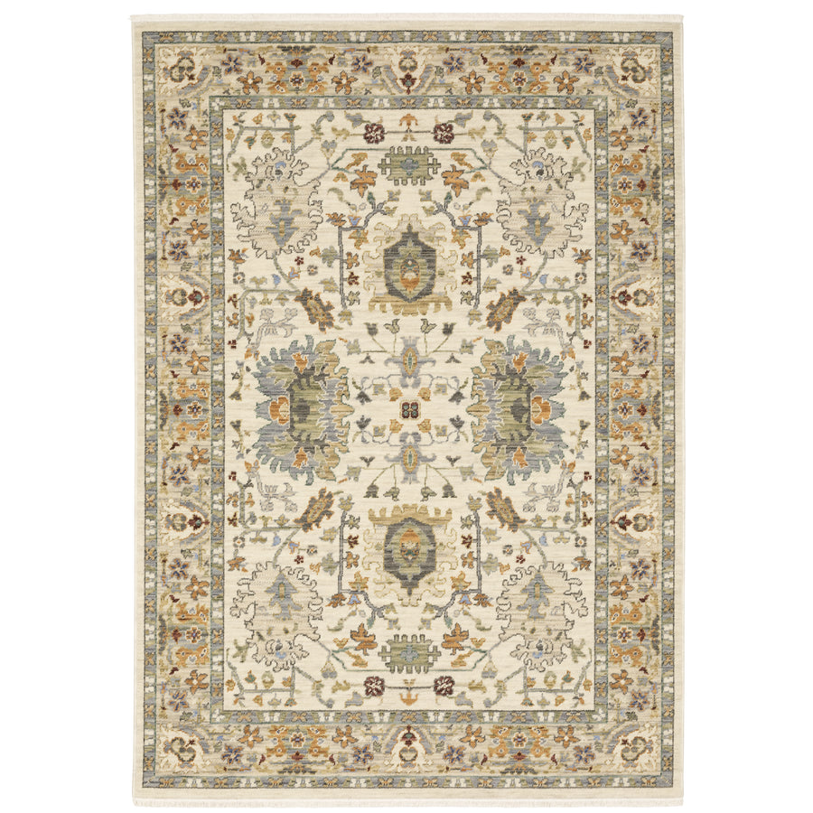 The Lucca 2063Y Area Rug showcases intricate floral and geometric patterns in light beige, gold, blue, green, and brown with a detailed border—an elegant choice for contemporary spaces.