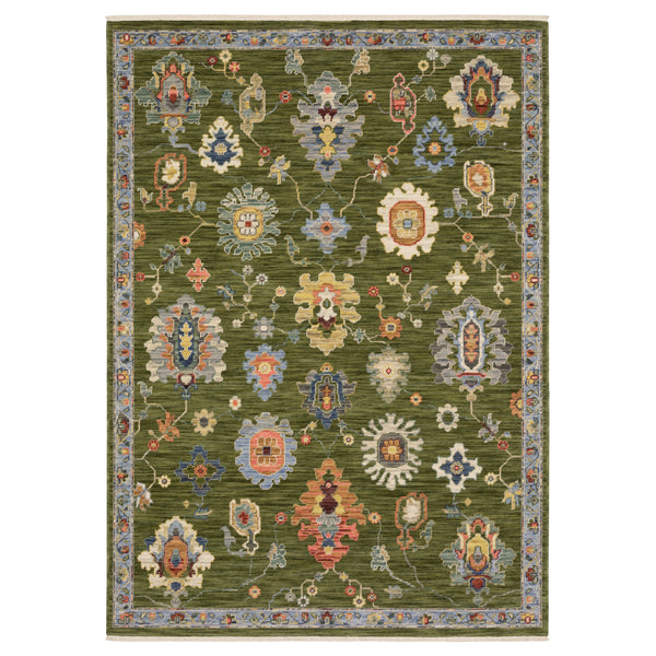 The Lucca 2863E Area Rug showcases a green base with vivid floral and geometric motifs, bordered by intricate blue and beige florals—a stylish choice for any floor.