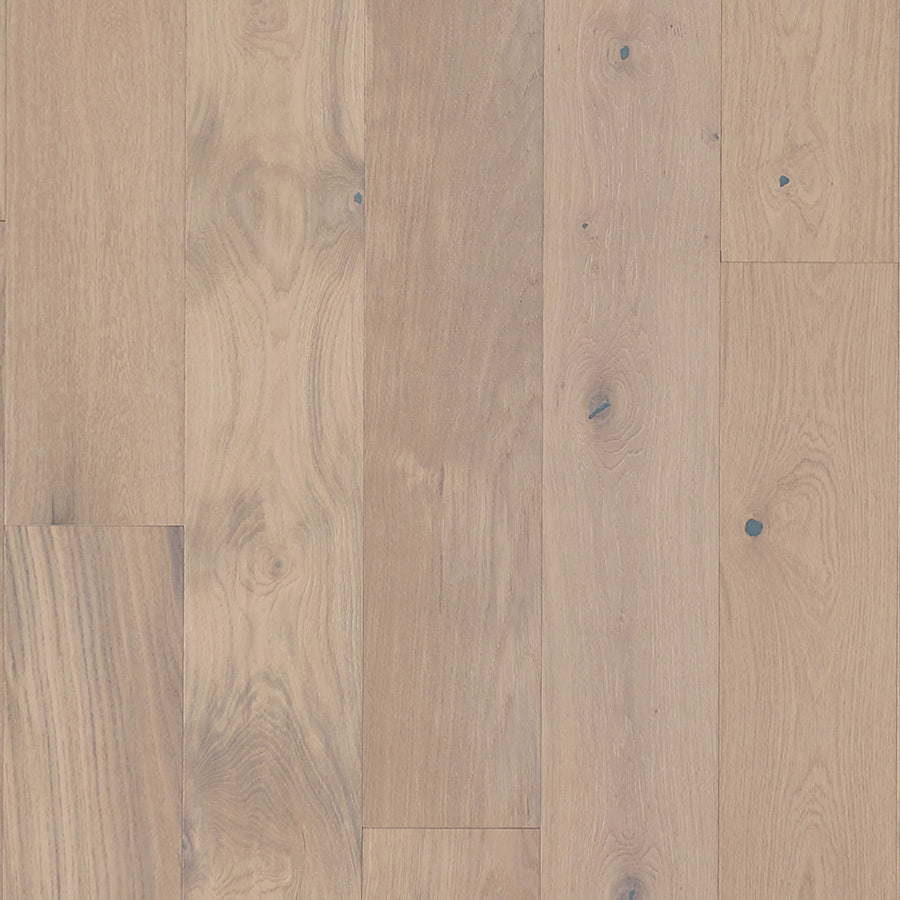 Main Street 7 1/2" White Oak Hardwood features light-toned premium planks with natural grain and knots, a smooth finish, subtle warmth, and an elegant staggered layout.