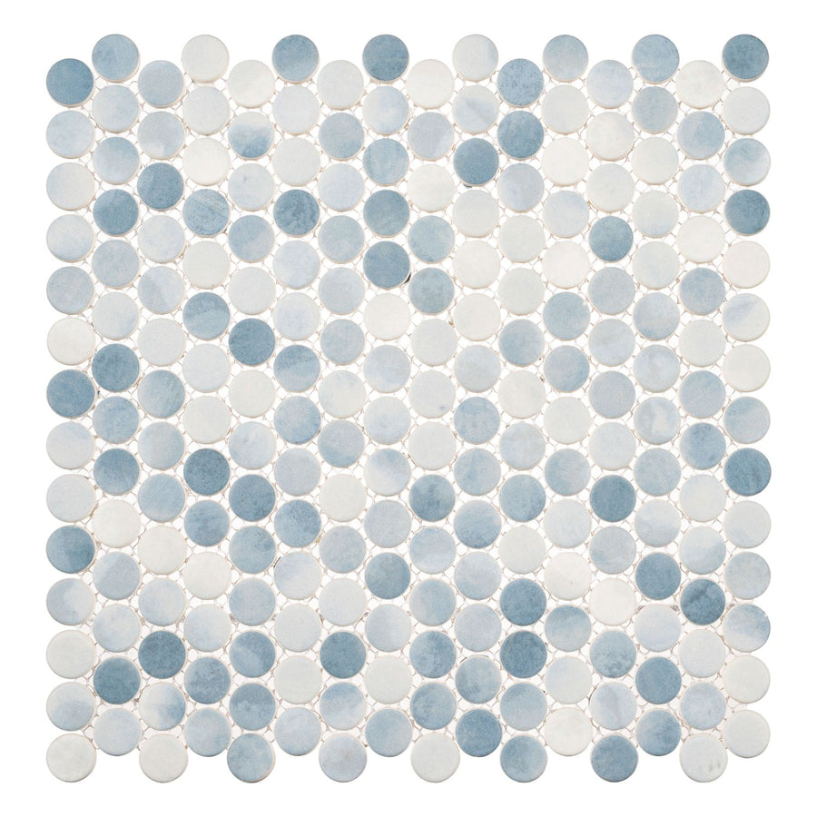 A square tile sheet features Polka Dots Pennyround Glass Mosaic Tile in the Seashore Waves color, displaying a grid of small, round tiles in blue, white, and light gray on a white background with a repeating pattern.