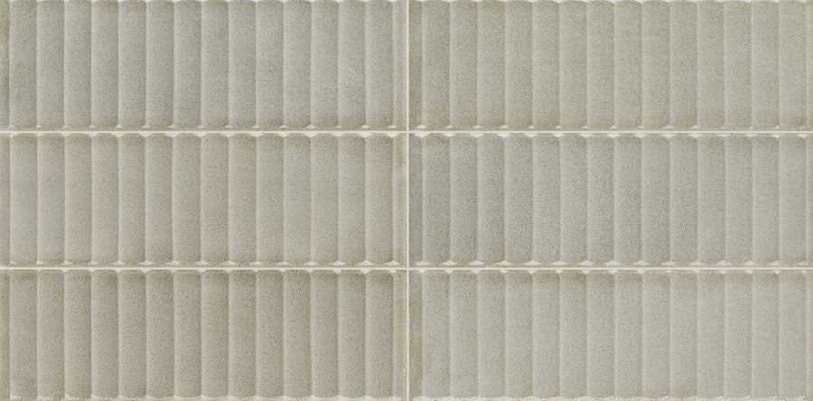 Close-up of Cadence 12" x 24" Fluted Tile in Denim, featuring a grid of six rectangular tiles with textured, horizontal ribbed design—ideal for adding modern style to bathroom walls.