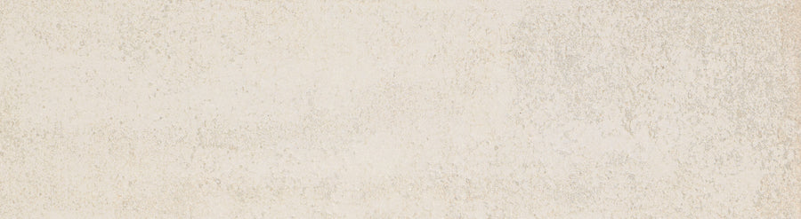 Hans.A 2.5" x 9" Subway Tile in Light features a textured off-white surface with subtle gray and beige speckles, evoking the look of weathered concrete—ideal for creating a luxurious backsplash or accent wall.